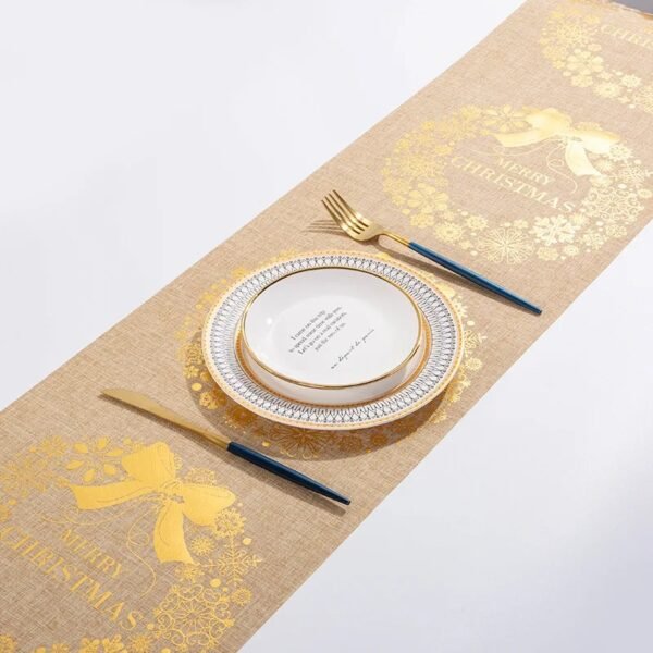 Christmas gold foil linen table runner with snowflake and tree prints in red, gold, and beige