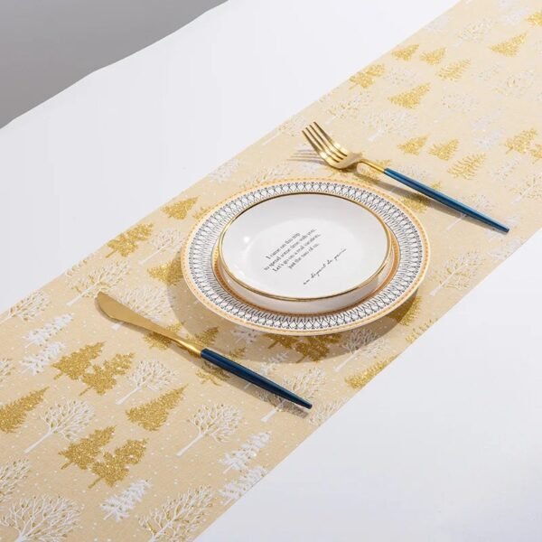 Christmas gold foil linen table runner with snowflake and tree prints in red, gold, and beige
