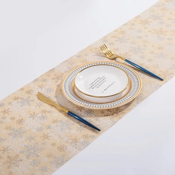 Christmas gold foil linen table runner with snowflake and tree prints in red, gold, and beige