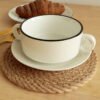 Rustic oval jute placemat made from natural jute rope, farmhouse style.
