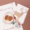 45x70 cm cotton tea towel with reindeer print folded beside holiday decor (3) 45x70 cm cotton tea towel with reindeer print folded beside holiday decor