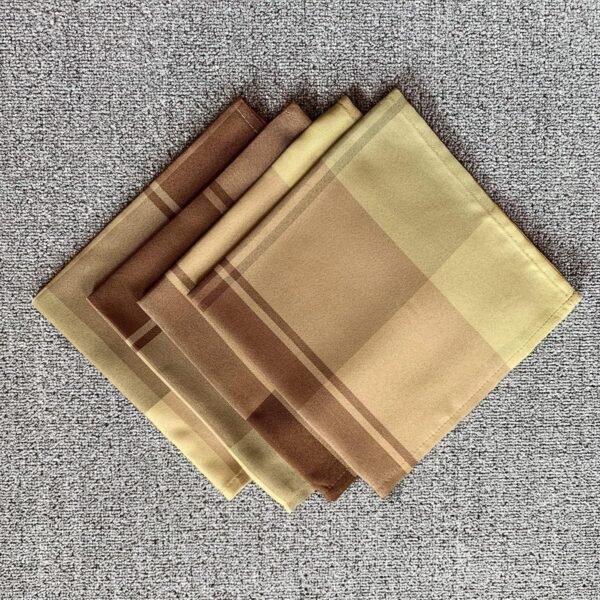 Brown check cotton napkin folded on rustic table setting