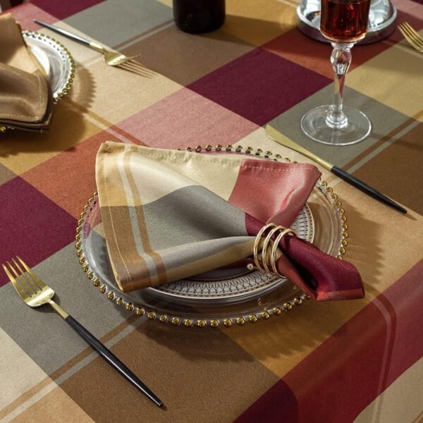Brown check cotton napkin folded on rustic table setting
