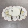 Christmas bell embroidered oval placemat, white cutwork design