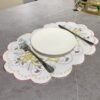Christmas bell embroidered oval placemat, white cutwork design