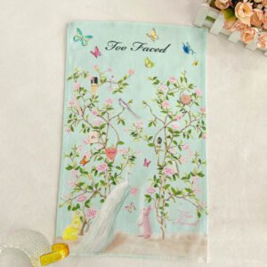 Green butterfly and bunny printed cotton tea towel with embroidered logo sample