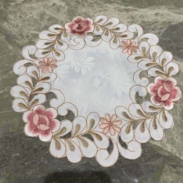 Pink round embroidered placemat for cups and bowls