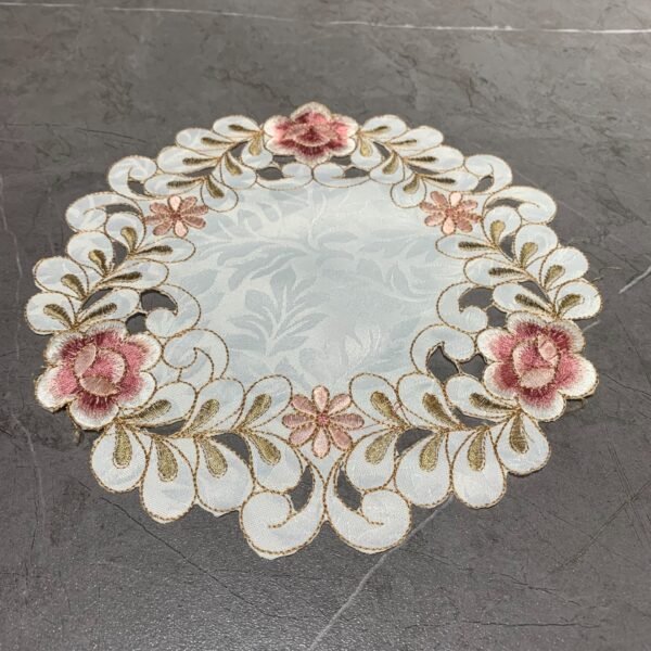 Pink round embroidered placemat for cups and bowls