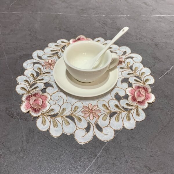 Pink round embroidered placemat for cups and bowls