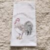 Thick custom cotton tea towel with embroidered logo on wooden table (7) Thick custom cotton tea towel with embroidered logo on wooden table