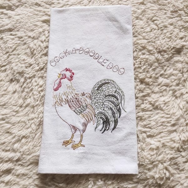 Thick custom cotton tea towel with embroidered logo on wooden table (7) Thick custom cotton tea towel with embroidered logo on wooden table