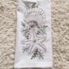 Thick custom cotton tea towel with embroidered logo on wooden table (8) Thick custom cotton tea towel with embroidered logo on wooden table