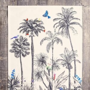 Vibrant printed cotton napkin folded on table with utensils