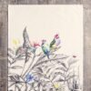 Vibrant printed cotton napkin folded on table with utensils