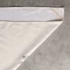 Vibrant printed cotton napkin folded on table with utensils