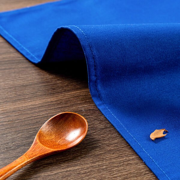 blue cotton napkin (2) Blue solid cotton napkin folded neatly beside tableware