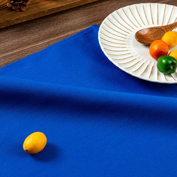 blue cotton napkin (3) Blue solid cotton napkin folded neatly beside tableware