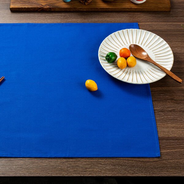 blue cotton napkin (4) Blue solid cotton napkin folded neatly beside tableware