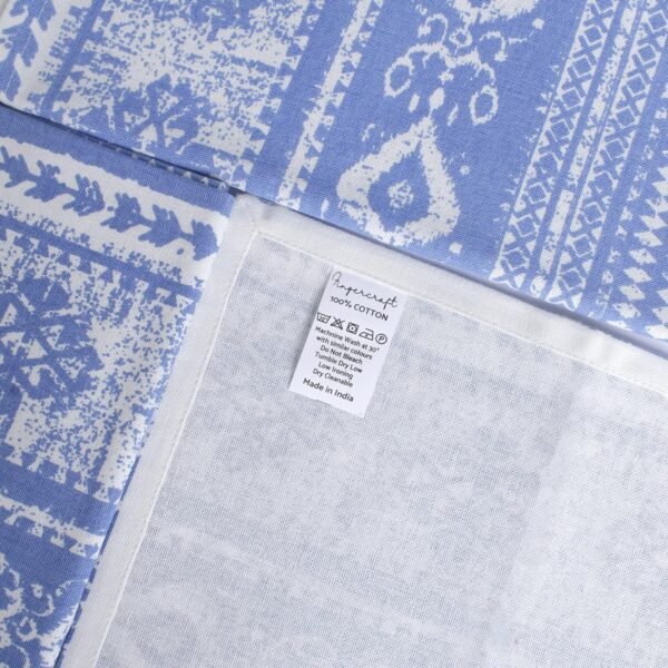 blue cotton napkin (4) Blue woven cotton napkin folded neatly on a table setting