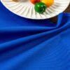 blue cotton napkin (5) Blue solid cotton napkin folded neatly beside tableware