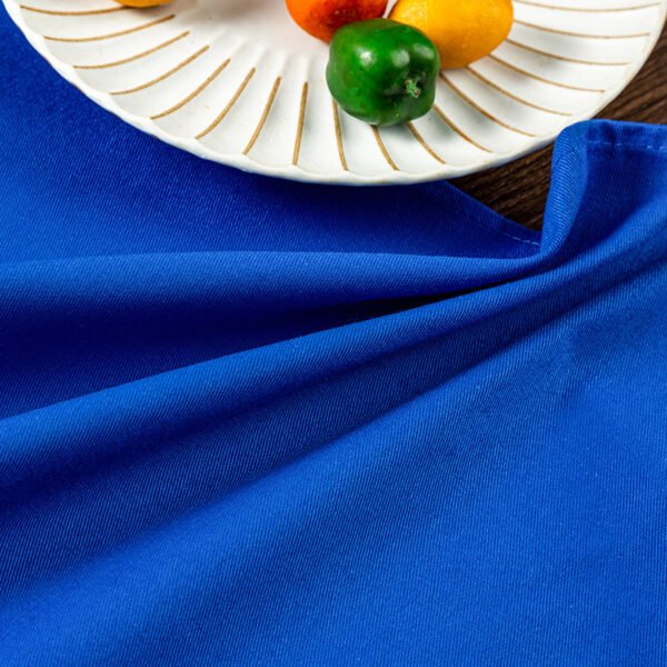 blue cotton napkin (5) Blue solid cotton napkin folded neatly beside tableware