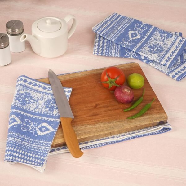 blue cotton napkin (5) Blue woven cotton napkin folded neatly on a table setting