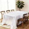 Elegant white tablecloth with wooden chairs
