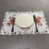 Candle and bell embroidered placemat