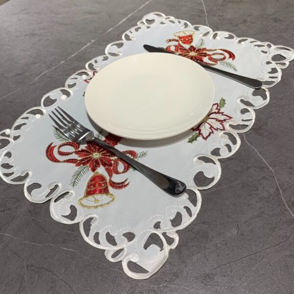 Candle and bell embroidered placemat