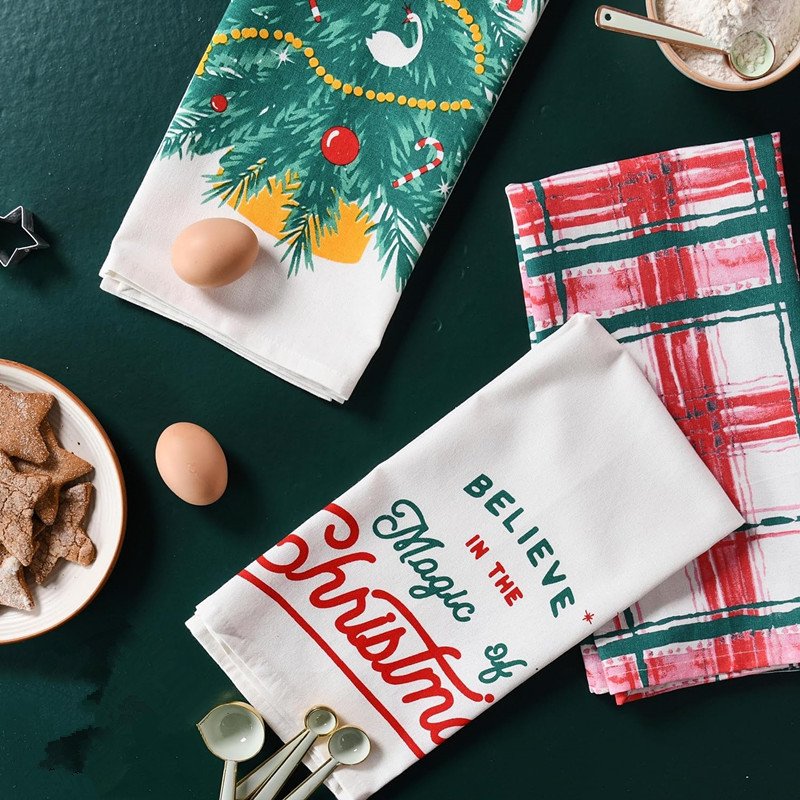 Christmas-themed kitchen towels and decorations