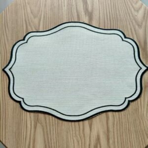 Oval beige linen embroidered placemat with cutwork
