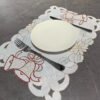 White bell embroidered placemat