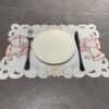 White bell embroidered placemat