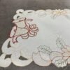 White bell embroidered placemat